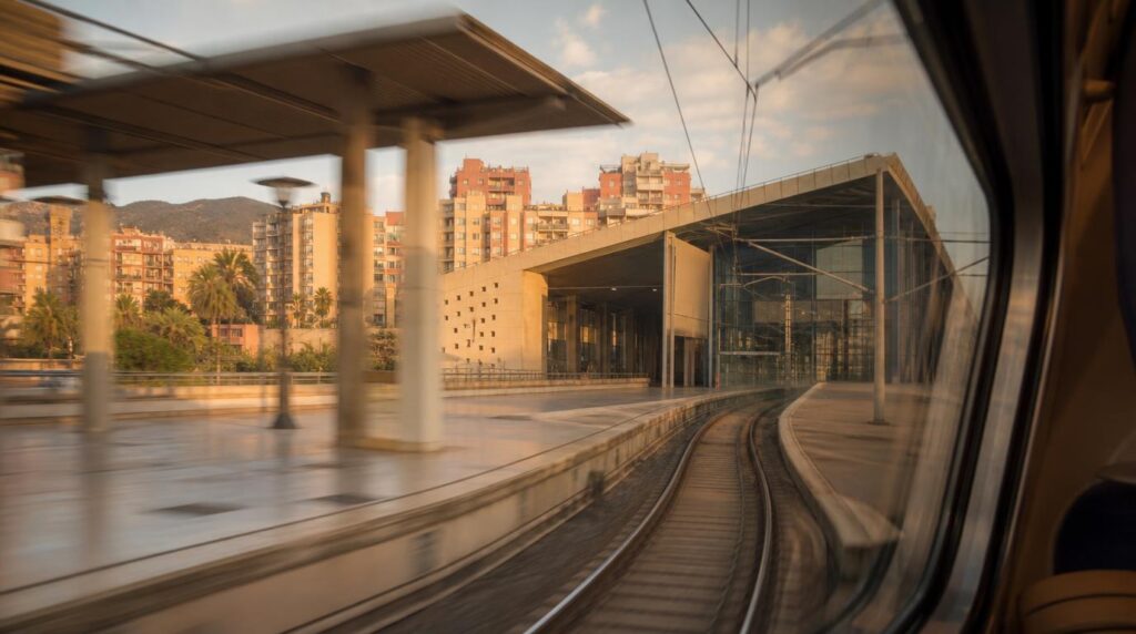 View from a train window pulling into Malaga's Maria Zambrano station,